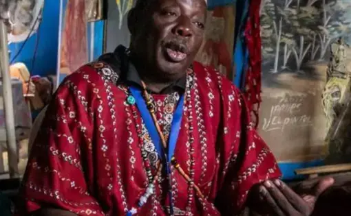 a Voudou representative sits for an interview