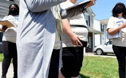 community organizers canvass in a neighborhood