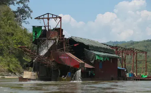 A gold-dredging boat on the Mali River in Kachin State, Myanmar.