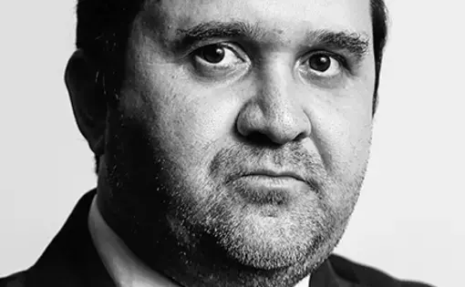 A man looks into the camera