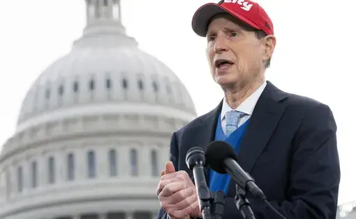 Sen. Ron Wyden speaks in front of the capitol building