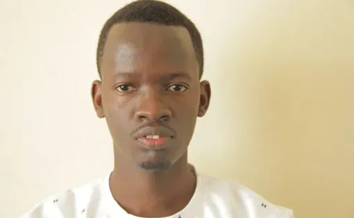 A person wears a white shirt.