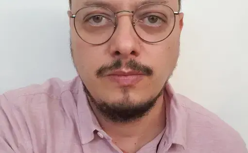 man stares at camera