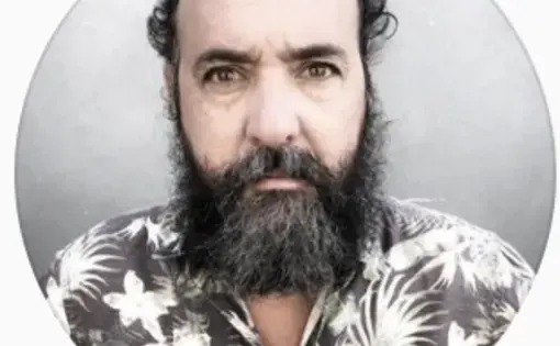 A man stares into the camera