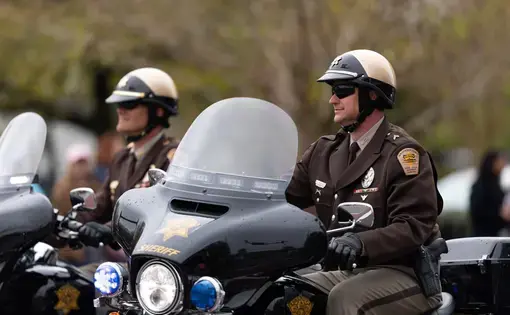 Sheriffs in North Carolina sitting on scooter