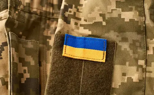 Ukrainian flag on military uniform.