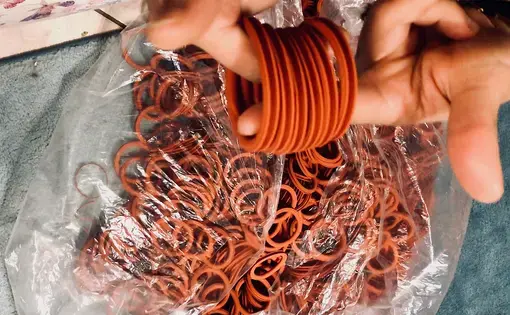 rubber gaskets in hand