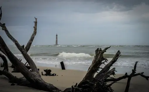 Beach with view of a lighthouse on James Island, South Carolina