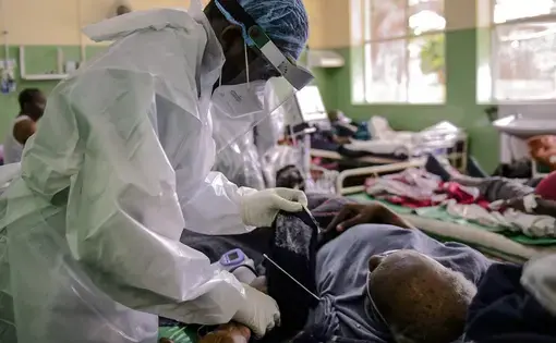 A doctor administers vaccinations.