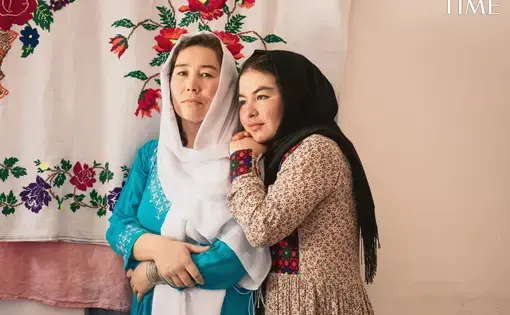 A mother and daughter embrace