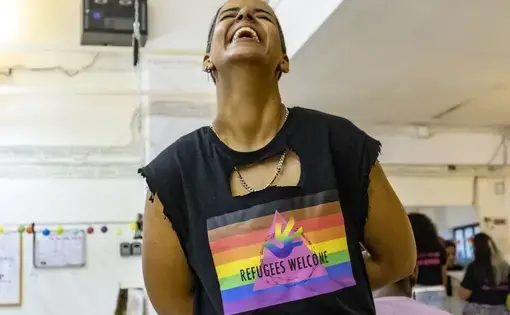 Arezou, an Iranian queer asylum seeker, created her fashion version of Safe Place International's T-shirt.