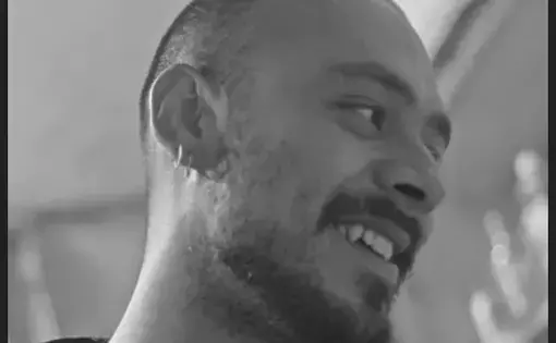a man looks to his right