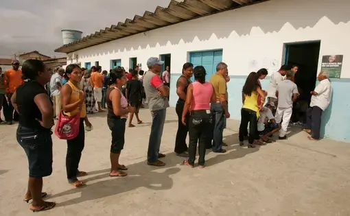 People queue to vote during elections in the city of Eunapolis. Brazil, 2010.