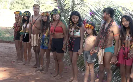 What does your food have to do with the invasion of Indigenous land? video screenshot - young Indigenous people stand in a line, holding hands