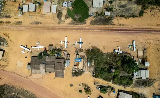 Airplanes parked on the edge of the runway of the 180, glued to the Trans-Amazon Highway and which acts as a strategic stopover for flights towards prospectors inside the forest. Image by Anderson Coelho/Intercept Brasil. Brazil, 2022.