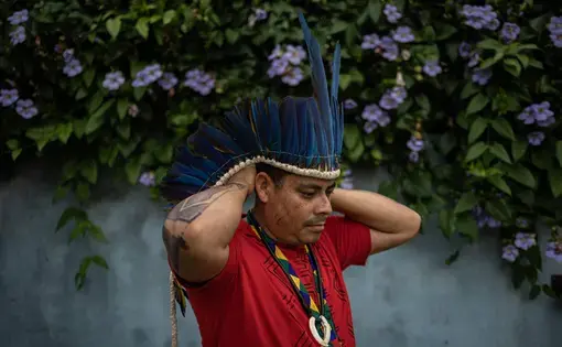 a man uses Indigenous accessories.