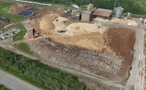 An aerial view shows thousands of logs piled up at the Meadowbank pellet plant near Prince George, B.C.