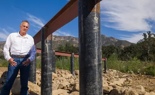 Montecito resident Curtis Skene stands in the mountains