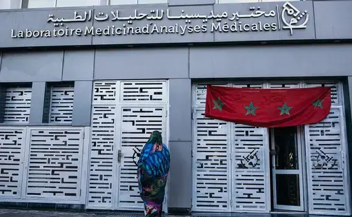 A person stands outside of a national laboratory