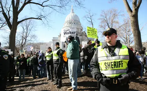 Deputies with the Dane County Sheriff Dept stood guard at a rally organized by the Tea Party on February 19, 2011 in Madison, Wisconsin.