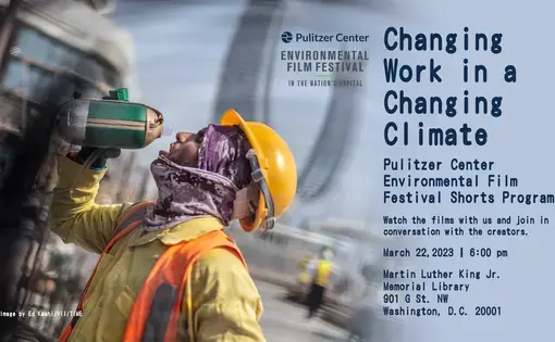 A worker in construction gear throws his head back as he drinks from a water bottle