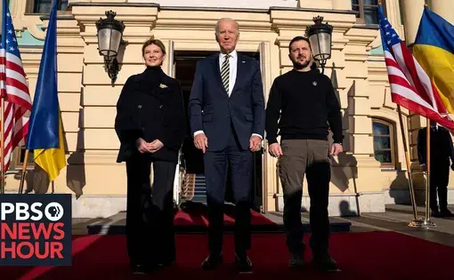 Youtube thumbnail: President Biden, and President and Mrs. Zelenskyy stand outside of the a building with Ukrainian and American banners to either side.