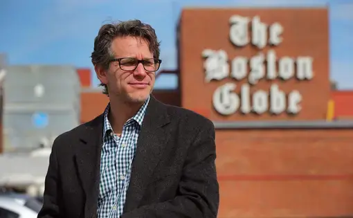 David Abel in front of The Boston Globe sign