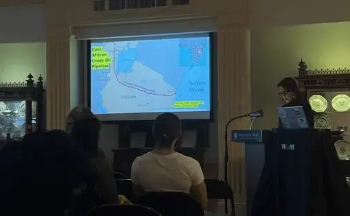 A person presents at a podium