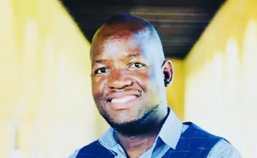 Divine Dube headshot