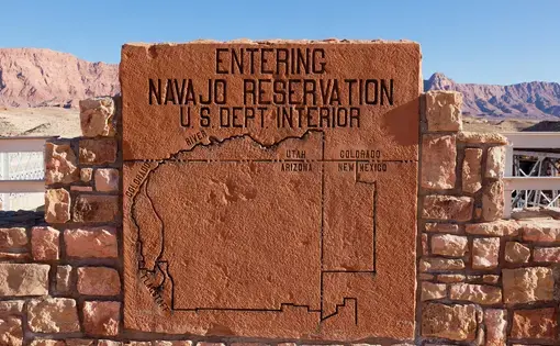 LEE'S FERRY, ARIZONA - JANUARY 25 2011: A rock sign showing a map area of the Navajo Nation placed by the Navajo Bridge just north of the Grand Canyon National Park
