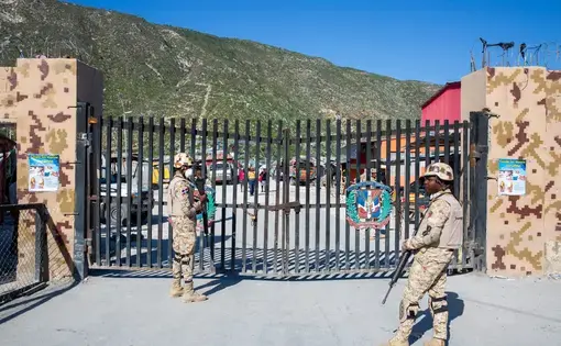 soldiers outside a gate