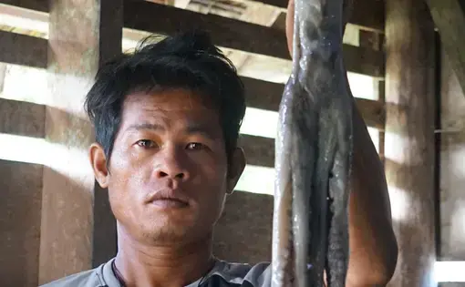 man holds a squid