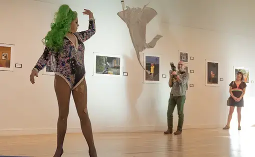 Drag queen performs in gallery