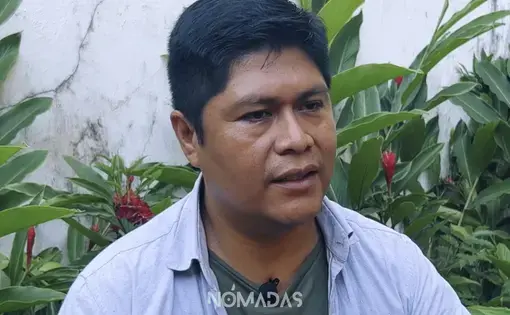A mid-shot of a man in blue shirt.