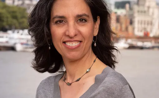 Headshot of a woman with medium length dark hair