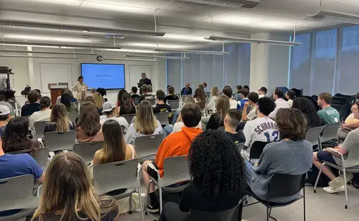 Students listen to Karen Hao speak