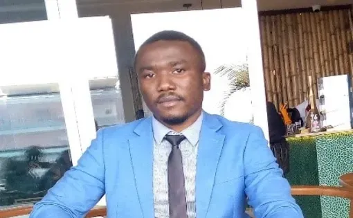 A man in blue suit.