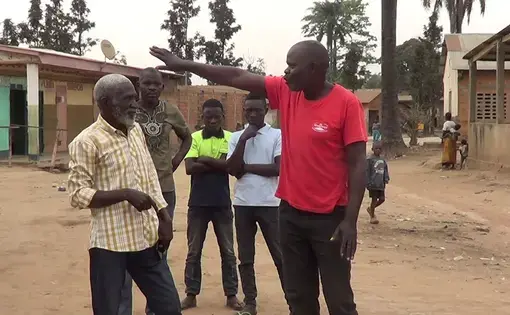Three men are talking.