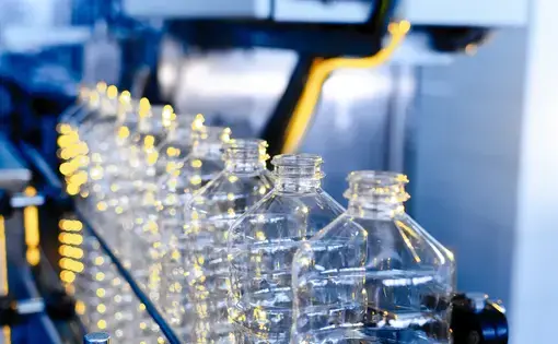 Factory line for manufacturing plastic bottles. Image by Salov Evgeniy/Shutterstock.