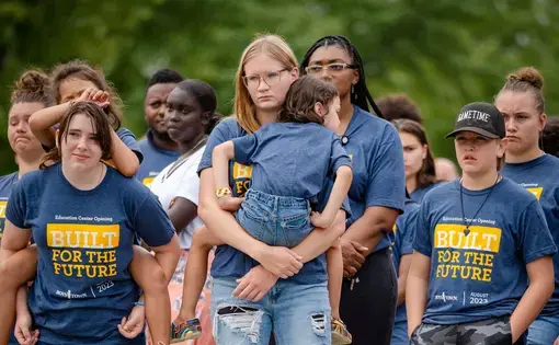 Boys Town residents watch the opening of a new school