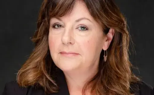 Headshot of a woman with shoulder-length brown hair