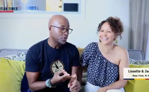 A couple, a Haitian man and a Dominican woman, talk and laugh