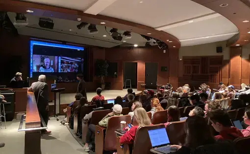 A virtual speaker in full indoor auditorium