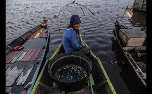 youtube thumbnail of a woman in a fishing boat