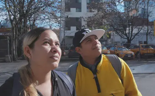Jeczebel Lopez and Jorge Ojeda stand in front of their shelter in New York.