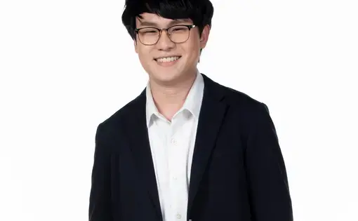 a headshot of Paris Jitpentom against white backdrop.