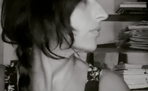 Black and white side profile of a woman with dark hair