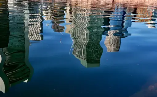 Boston city skyline reflected in harbor