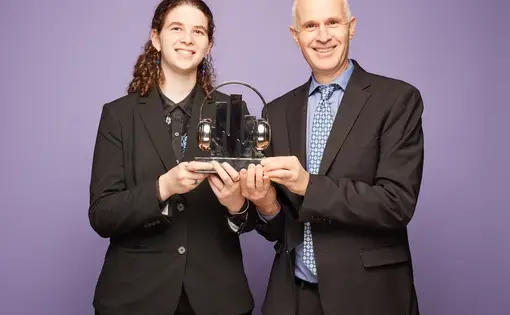 Micah and Sydney Fink accept a Signal Award