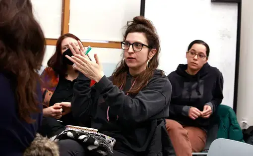 People speak at a town hall meeting
